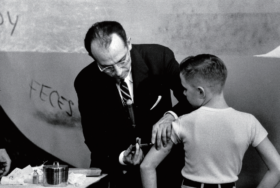 Dr. Jonas Salk innoculating a young boy w. his new polio vaccine. 1955. Photo by Al Fenn ⓒThe LIFE Picture Collection