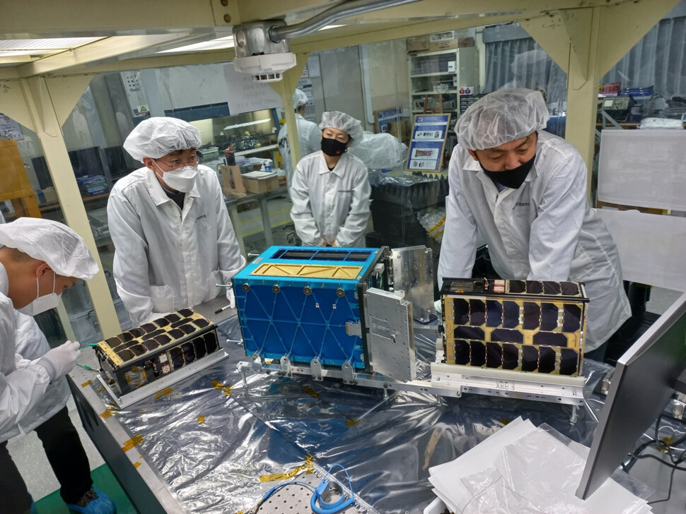 Researchers at the Korea Astronomy and Space Science Institute are installing and testing the launch tubes of the Toyosat Flight Model Units 3 and 4.  Provided by the Korea Astronomy and Space Science Institute