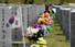 현충일(6일)을 앞둔 2일 대전시 유성구 갑동 국립대전현충원을 찾은 유가족이 묘비 앞에서 참배하고 있다. 연합뉴스