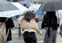 전국 곳곳에 장맛비가 내리기 시작한 23일 오전 서울 광화문광장에서 한 시민이 비를 맞으며 뛰어가고 있다. 연합뉴스