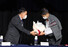 14일 오후 광주 서구 5·18 기념문화센터 대동홀에서 열린 ‘오늘의 증언이 5·18 진상규명의 첫걸음이다’ 행사에서 5월 항쟁 당시 계엄군이었던 김귀삼(왼쪽) 씨가 총상 피해자 김태수 씨에게 꽃다발을 주고 있다. 연합뉴스