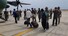 북아프리카 수단에서 군벌 간 무력 충돌 사태로 고립됐던 교민들이 24일(현지시각) 포트수단 공항에서 대기하던 한국 군용기에 탑승하고 있다. 대통령실 제공