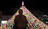 23일 오후 경남 거창군 거창읍 거창군청 주변에 매달린 오색 연등을 한 스님이 바라보고 있다. 연합뉴스