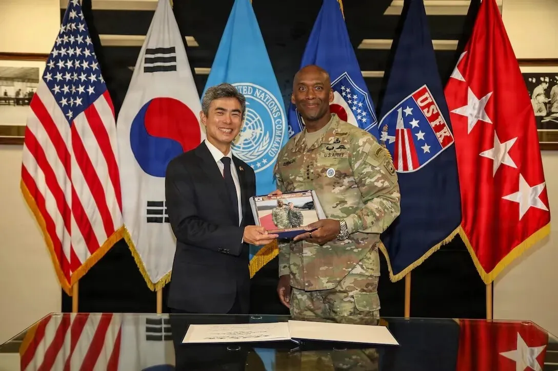 South Korean Defense Minister Kang Shin-chul presents a framed photograph to US Army Gen. Xavier T. Brunson, commander of United Nations Command, ROK-US Combined Forces Command and US Forces Korea, at USFK headquarters at Camp Humphreys, South Korea, on Oct. 2, 2026.