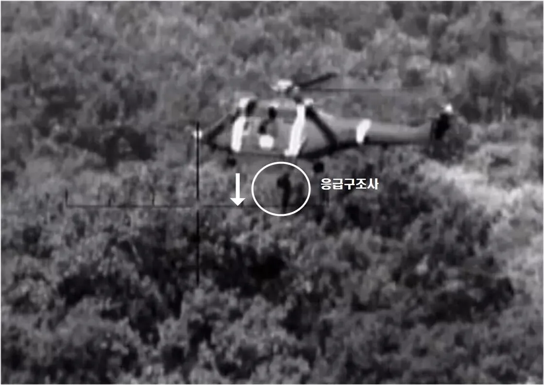 Rescuers hoist a soldier for medevac following the explosion of possible land mines in the DMZ. (courtesy Joint Chiefs)