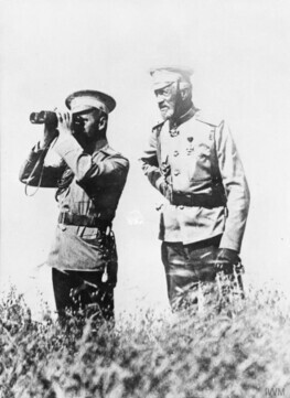 Czar Nicholas II (left) observes the front line of WWI.