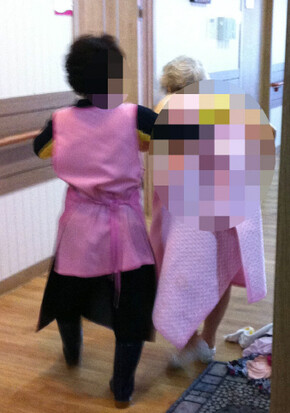 Lee Mal-sook is escorted back to her room after a bath by a nurse. Lee left the nursing home after just two days