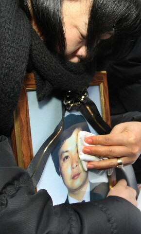  a bereaved family member who lost her husband in the Yongsan tragedy