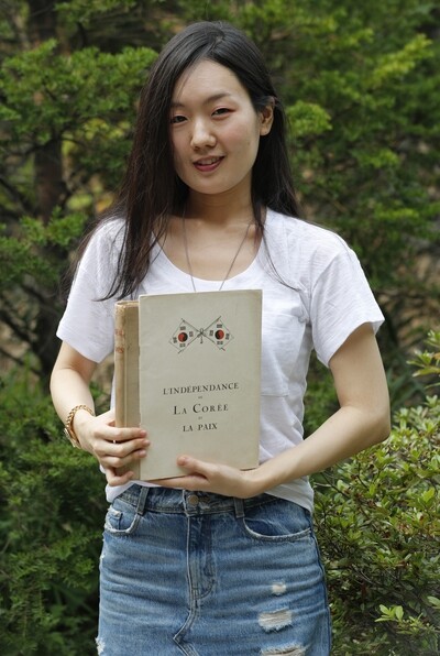 Ji Bo-ram poses with some of her rare and collectible books