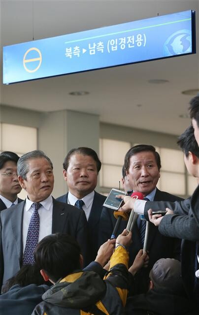  including chairman Chung Ki-sup (right) answer questions from reporters at the Inter-Korean Transit Office in Paju