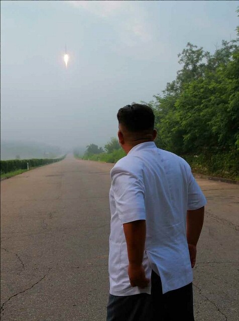 North Korean leader Kim Jong-un observes a missile launch