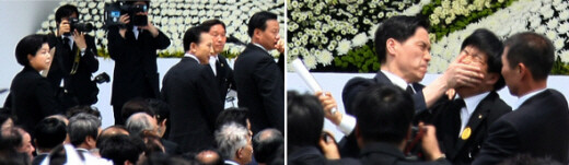  Cheong Wa Dae guards restrain Lawmaker Baek Won-woo’s for shouting “President Lee Myung-bak should apologize” at the public funeral service held for the late former President Roh Moo-hyun