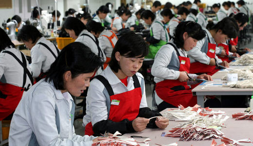 North Korean workers at a factory built by South Korean shoemaker Racere