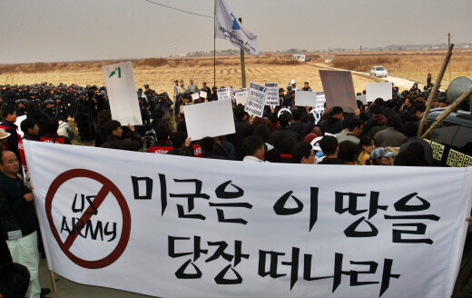  Gyeonggi Province members of civic organizations hold a banner that states