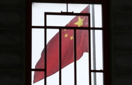 A Chinese flag at the Chinese Embassy seen through a window in a nearby building in Seoul on Aug. 4. (Yonhap News)