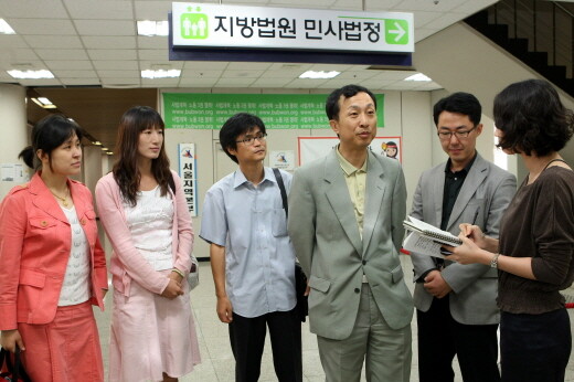  Professor at Korea National University of Education answers questions from reporters at Seoul Central District Court located in Seoul’s Seocho district