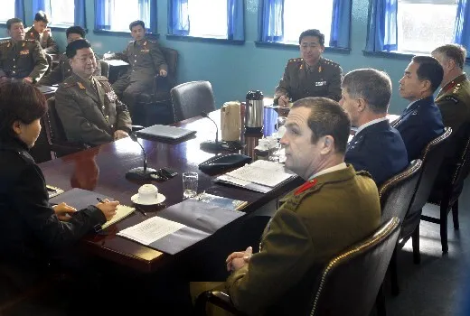  seated at left