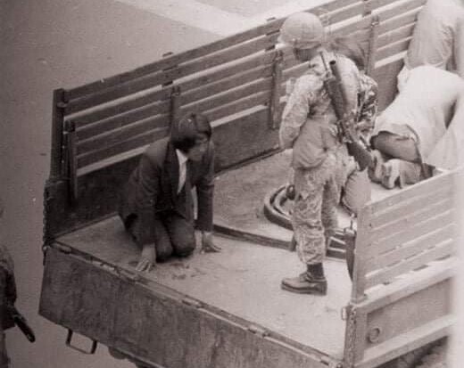 During the May 18 Gwangju Uprising, a Gwangju citizen kneels as a paratrooper deployed to suppress the uprising stands over them. (provided by the May 18 Memorial Foundation)