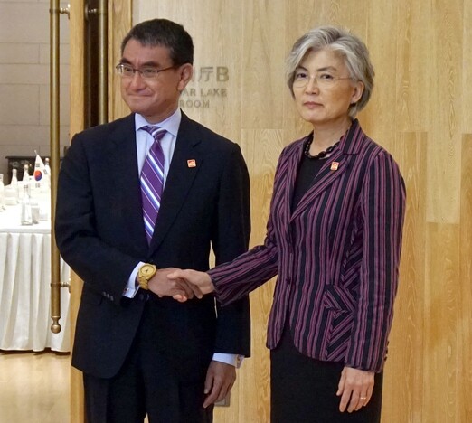 South Korean Foreign Minister Kang Kyung-wha with then Japanese Foreign Minister Taro Kono
