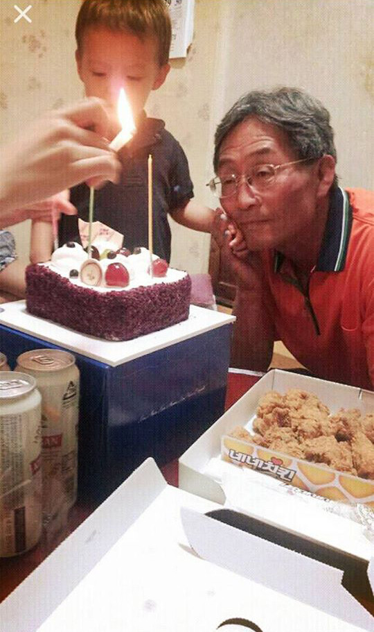 Farmer Baek Nam-gi in May at his grandson’s second birthday party. (provided by Baek’s daughter)