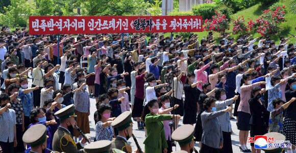 North Korean women denounce the launhces of balloons filled by anti-North propaganda by North Korean defector groups in front of the Museum of American War Atrocities in Sinchon County, South Hwanghae Province, on June 9.