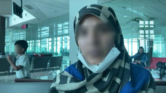 An Afghan woman agrees to an interview with the Ministry of Foreign Affairs at the Islamabad International Airport after she was taken there from the Kabul airport in Afghanistan. (provided by the Ministry of Foreign Affairs)