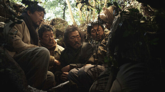  which depicts Jeju Islanders taking refuge from the military suppression of a 1948 demonstration on the island. Thousands of island residents were massacred by the military. (provided by the Safari Film)