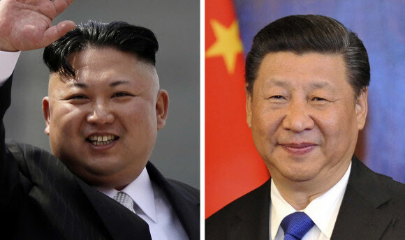 North Korean leader Kim Jong-un (left) and Chinese President Xi Jinping (AP/Yonhap News)
