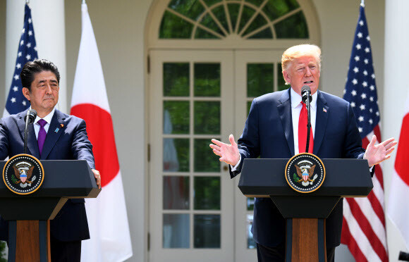 US President Donald Trump and Japanese Prime Minister Shinzo Abe hold a press conference after their summit at the White House on June 7. (UPI)