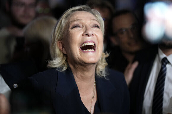 Marine Le Pen celebrates favorable exit polls for her National Rally party during the first round of voting in the snap general election in France on June 30, 2024 (local time). (AP/Yonhap)