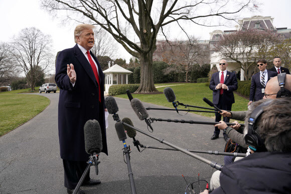 US President Donald Trump speaks to reporters in front of the White House before heading to Ohio on Mar. 20.