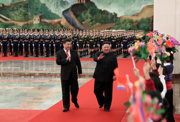 North Korean leader Kim Jong-un and Chinese President Xi Jinping during a welcome ceremony for Kim at the Great Hall of the People in Beijing on Jan. 8. (Xinhua News/AFP)
