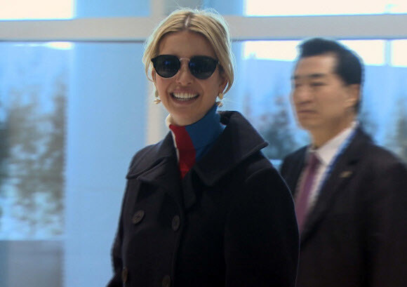 Ivanka Trump smiles as she departs from Incheon International Airport to return to Washington