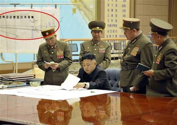  in an image released by the Korean Central News Agency on Mar. 29. Kim presided over a operations meeting and ordered them to remain on stand-by for a possible missile strike. (KCNA/Yonhap News)
