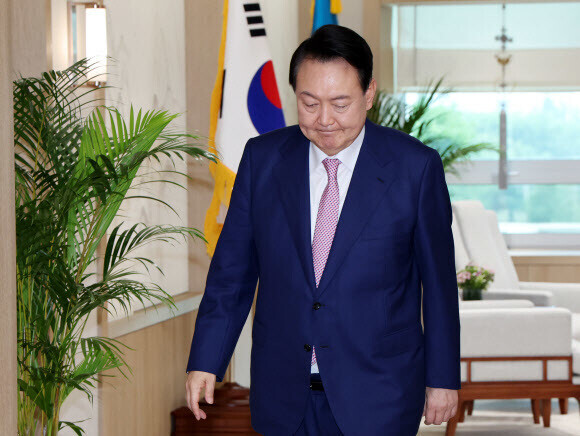 President Yoon Suk-yeol makes his way to a ceremony to receive the credentials of foreign envoys in Seoul at his presidential office in Seoul’s Yongsan District on July 29. (Yonhap News)