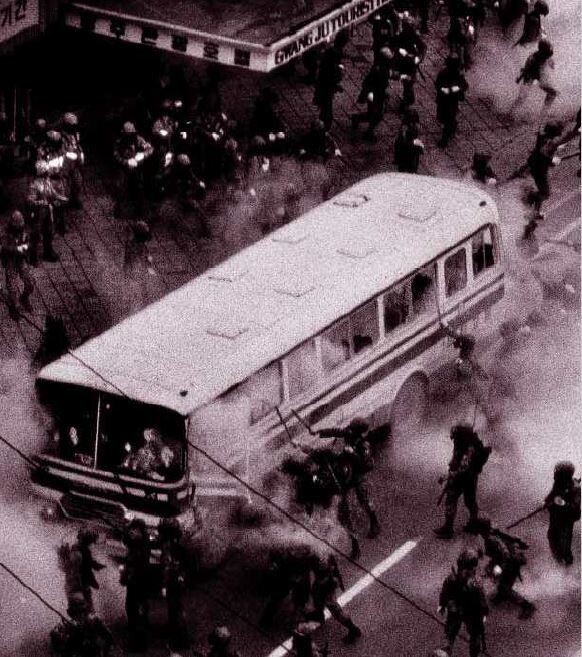 Martial law forces pull demonstrators from a city bus and beat them with clubs on May 20, 1980. (provided by the May 18 Memorial Foundation)