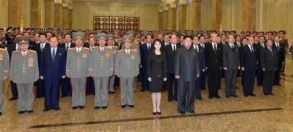  flanked by his wife Ri Sol-ju