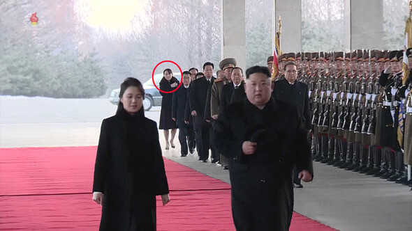 North Korean leader Kim Jong-un and first lady Ri Sol-ju prepare to depart for China on Jan. 7. Kim’s younger sister and WPK Propaganda and Agitation Department Director Kim Yo-jong is seen following closely behind. (KCTV/Yonhap News)