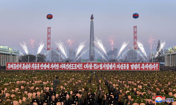 Members of the military gather for a fireworks show on the banks of the Taedong River in Pyongyang on Dec. 1 celebrates the successful launch of the Hwasong-15 missile.