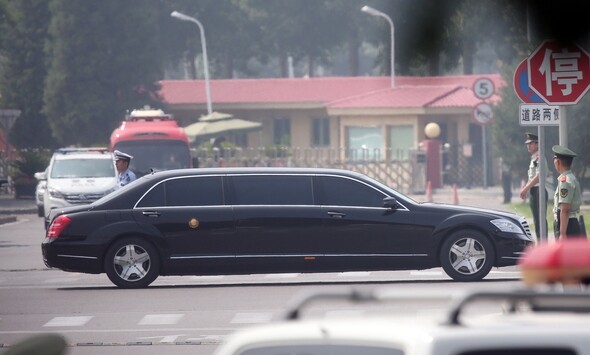A car assumed to be transporting Kim is seeing leaving China Capital International Airport on the morning of June 19.