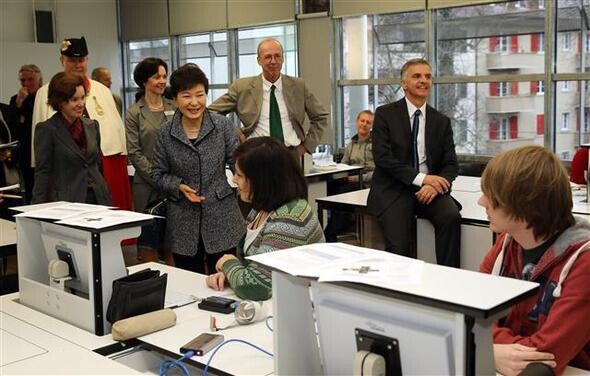 President Park Geun-hye greets students at the Commercial and Industrial training College (GIBB) in Bern