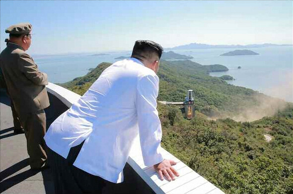 North Korean leader Kim Jong-un observes the test of a high-powered rocket engine