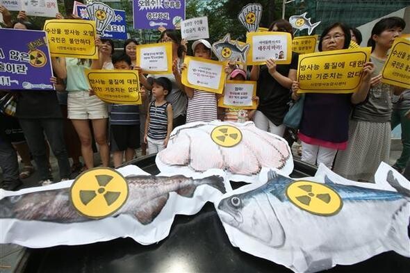 Members of civic groups including the Citizens Radiation Monitoring Center and Women’s Environmental Solidarity hold a protest in front of the Japanese embassy in Seoul’s Jongno district calling on the South Korean government to halt imports of Japanese seafood from waters that were contaminated with radiation after the 2011 Fukushima nuclear crisis
