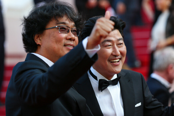 South Korean filmmaker Bong Joon-ho (left) with South Korean actor Song Kang-ho at the Cannes Film Festival on May 25. (Yonhap News)