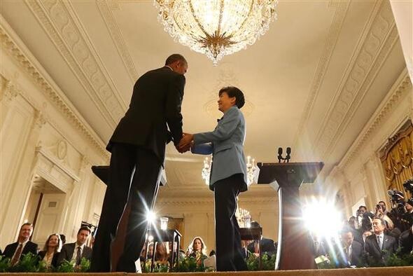President Park Geun-hye shakes hands with US President Barack Obama after a press conference at the White House
