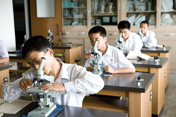 Students working with microscopes at Pyongyang’s First Middle School