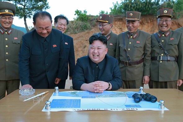 North Korean leader Kim Jong-un observes the test launch of a Hwasong-12 intermediate-range ballistic missile (IRBM)