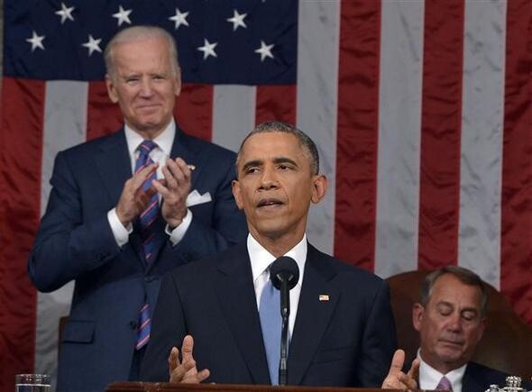  as Vice President Joseph Biden (left) applauds