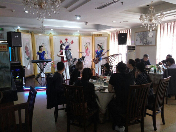 Staff at a North Korean restaurant in Beijing perform “Arirang.” The restaurant was operating as normal in the days after a group defection from elsewhere in China to South Korea.
