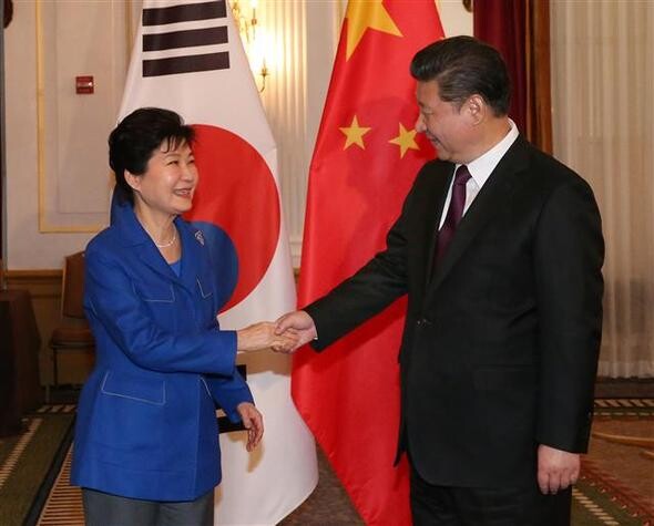 President Park Geun-hye shakes hands with Chinese President Xi Jinping during their bilateral summit in Washington D.C